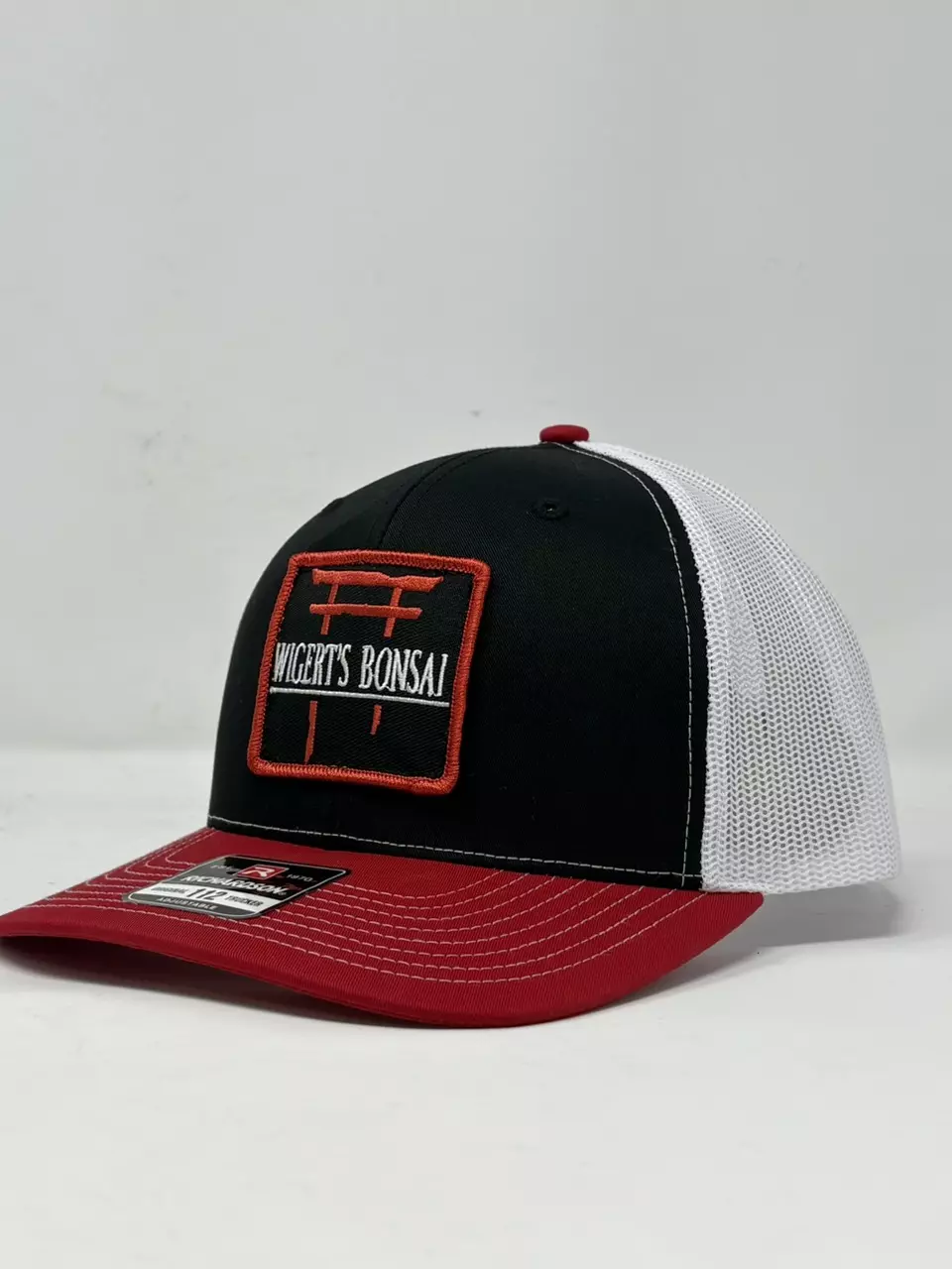 plant/RED BLACK AND WHITE LOGO TRUCKER HAT-0