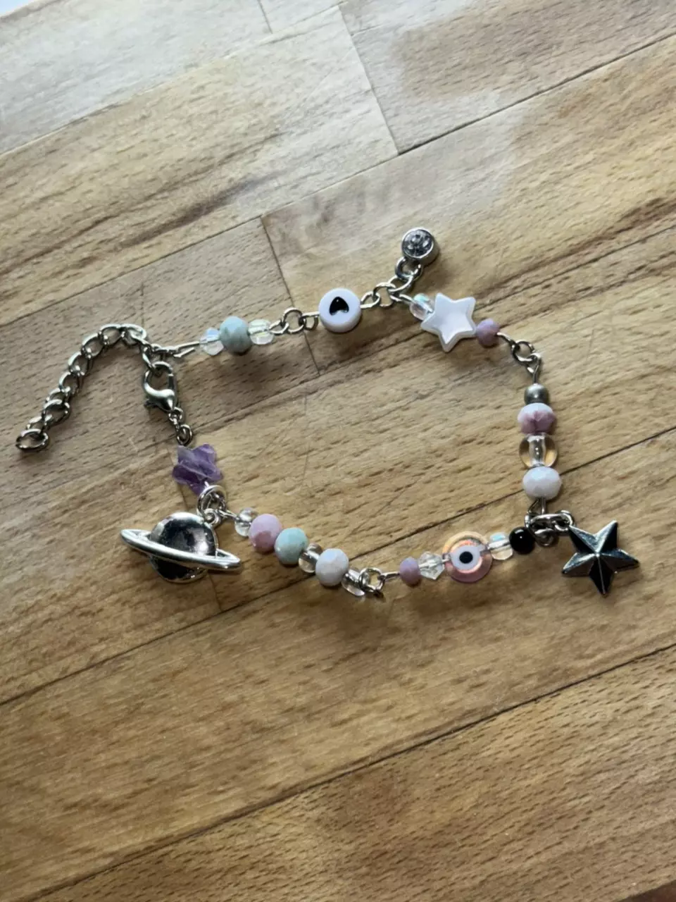 plant/Beaded Bracelet with Star and Saturn charm-1