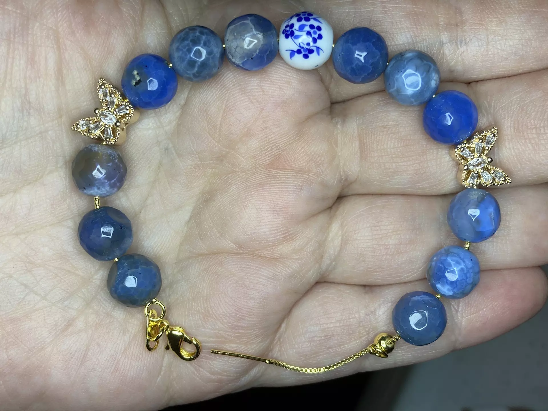 plant/New dyed blue agate faceted beads with ceramic focal bead and 2 butterfly CZ charms bracelet -0