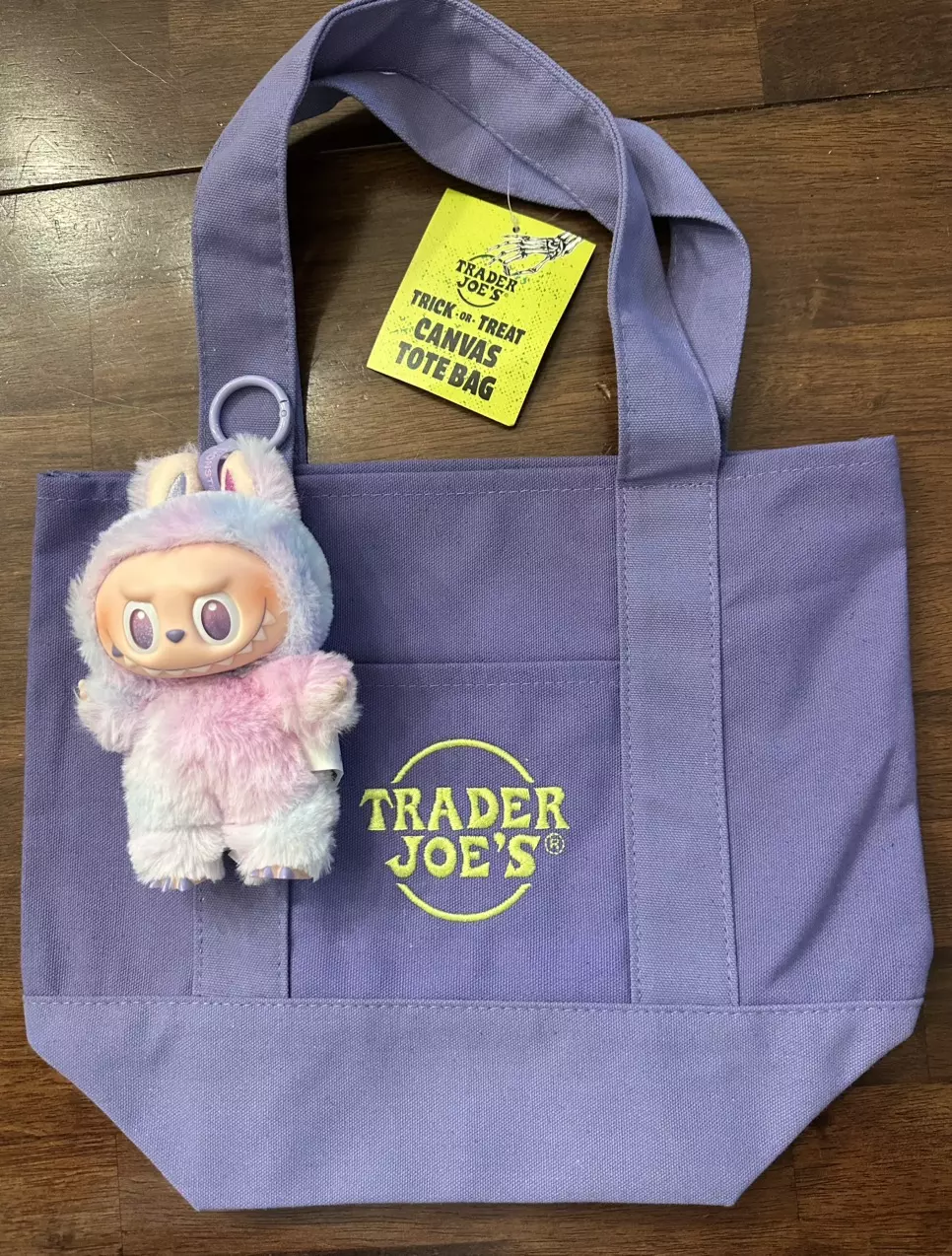 Big into Energy Luck and Purple Trader Joes Trick or Treat tote *In hand* thumbnail