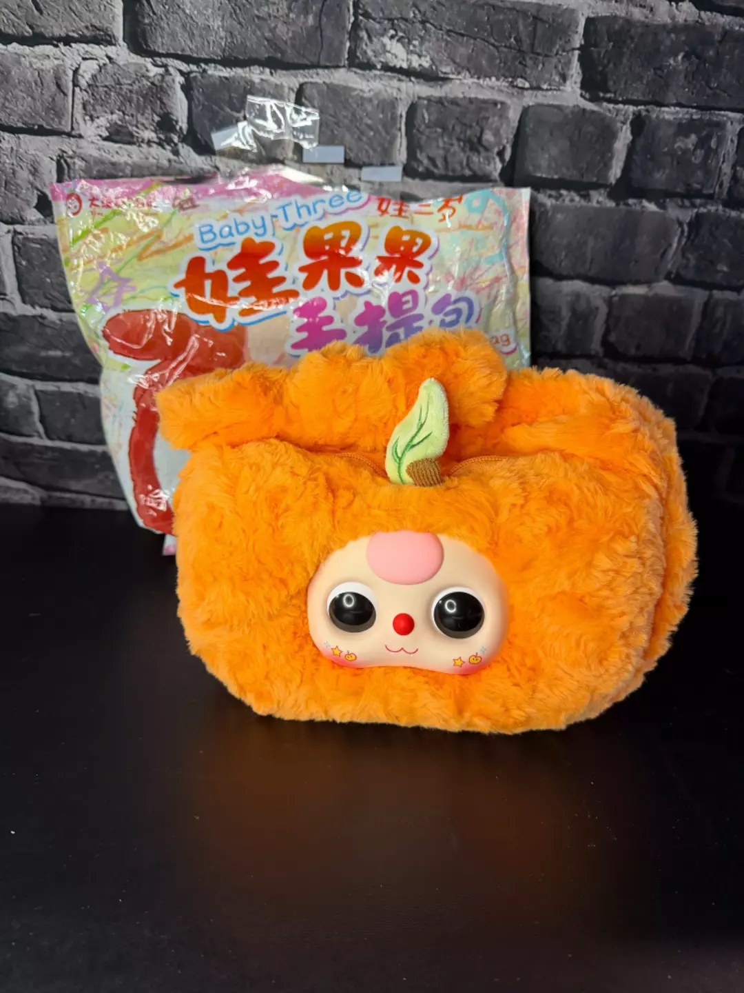16. Confirmed: Baby Three Baby Fruit Handbag: Orange Plush Zipper Handbag thumbnail