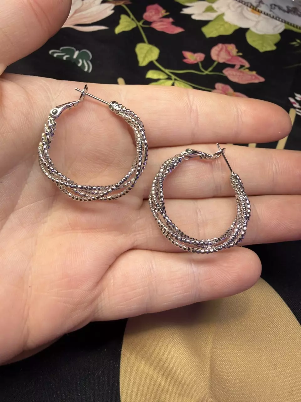 Silver tone braided hoop earrings thumbnail
