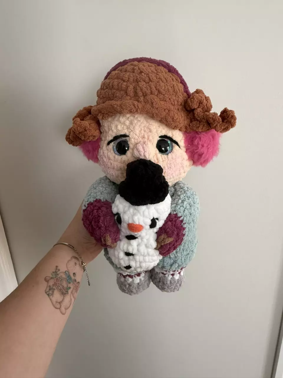 Handmade Crochet Doll with Pink Earmuffs and Snowman thumbnail