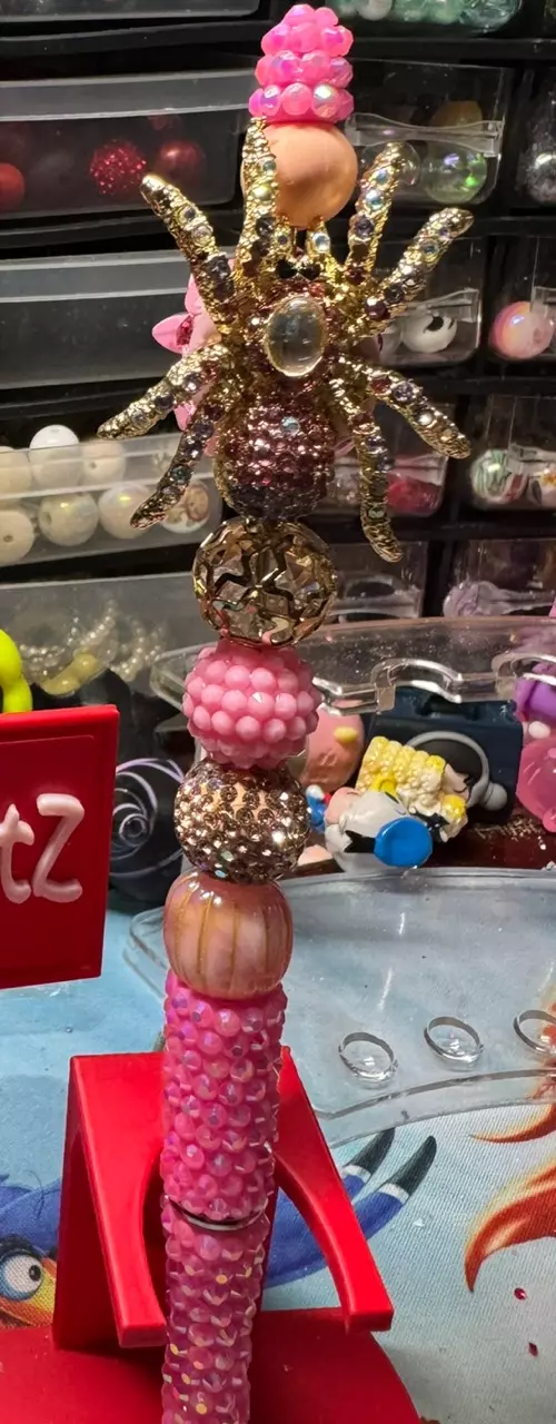 Beautiful fancy spider focal on a pink rhinestone pen with an extended rod thumbnail
