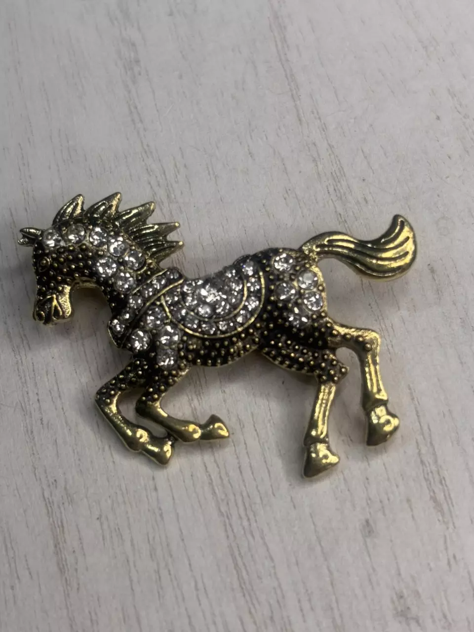 Sparkly gold tone Pegasus brooch with rhinestones ✨
Super cute statement piece b thumbnail
