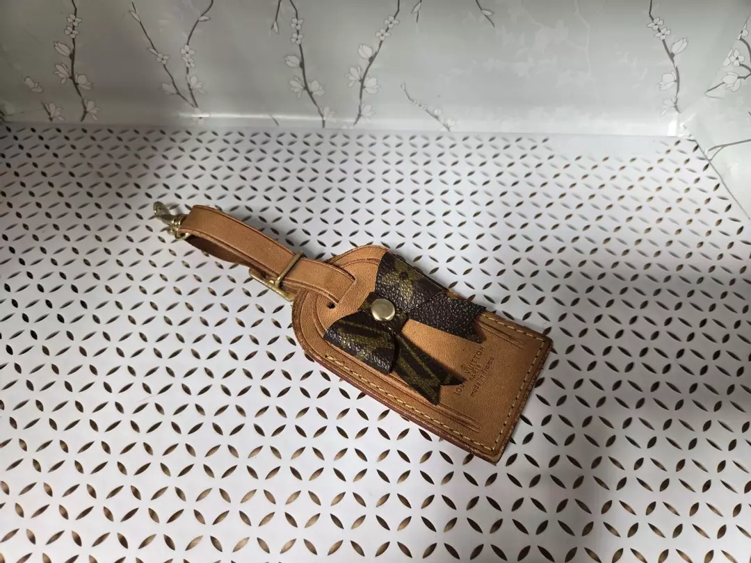 authentic luggage tag with upcycled bow thumbnail