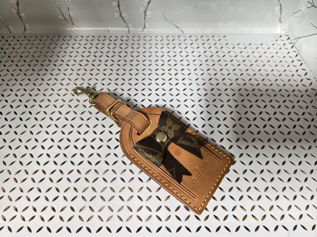 authentic luggage tag with upcycled bow. thumbnail