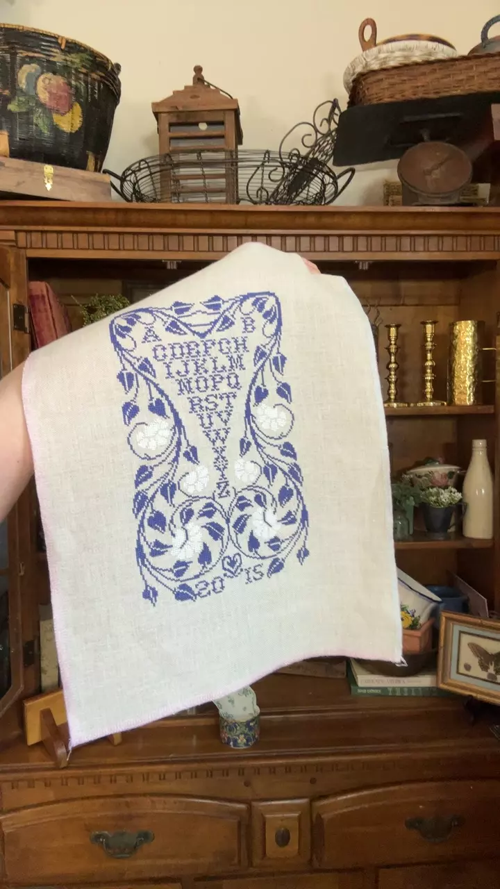 blue and white cross stitch sampler thumbnail