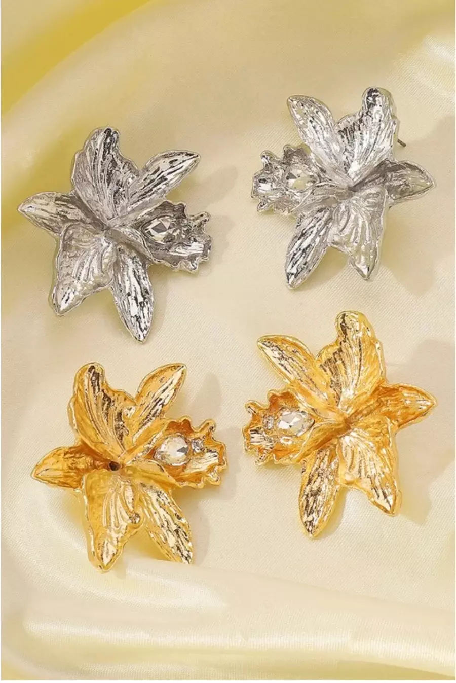 Gold pleaded and silver earrings thumbnail