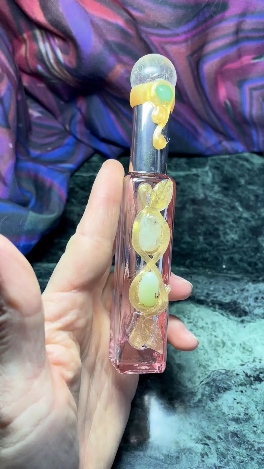 Glass perfume bottle with crystals on the top and front thumbnail